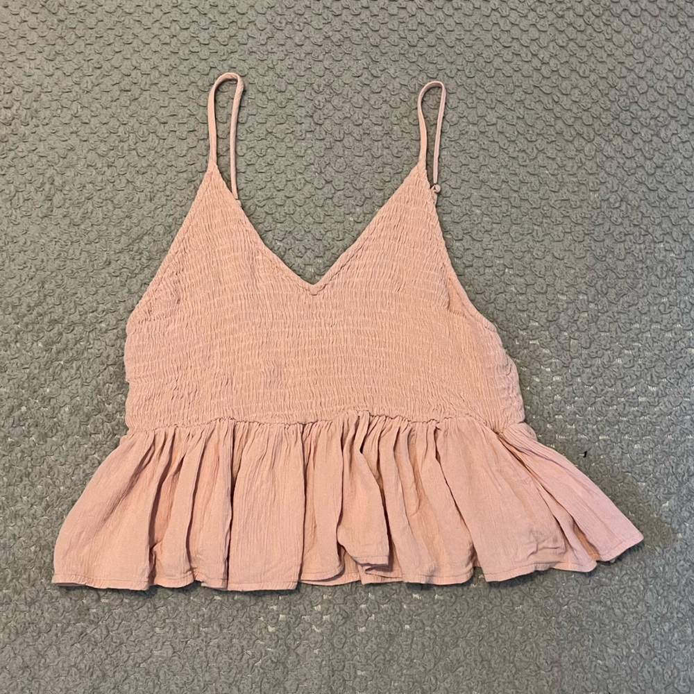 Pink ruffle crop top bought at boutique store. Fits size XS